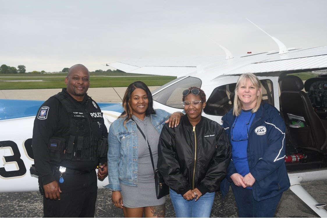 Participant Jordyn Brown is shown is shown with her team